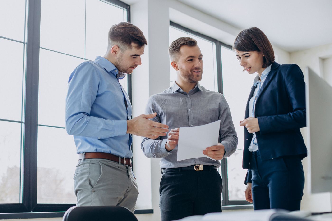 GigCare plan details — business team reviewing documents in an office